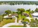 Aerial view of waterfront property with two houses at 180 N Lakewood Cir, Maitland, FL 32751