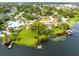 Aerial view of waterfront property with large yard and dock at 180 N Lakewood Cir, Maitland, FL 32751