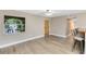 Living room with hardwood floors and access to kitchen at 180 N Lakewood Cir, Maitland, FL 32751