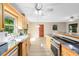 Open concept kitchen with island and access to patio at 180 N Lakewood Cir, Maitland, FL 32751