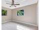 Spacious bedroom with ceiling fan and neutral colored walls at 180 N Lakewood Cir, Maitland, FL 32751