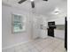 Kitchen with white cabinets and access to backyard at 793 E Birchwood Cir, Kissimmee, FL 34743