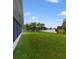 Backyard with view of lake and fenced area at 793 E Birchwood Cir, Kissimmee, FL 34743