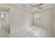 Bedroom with access to bathroom and tile flooring at 793 E Birchwood Cir, Kissimmee, FL 34743