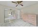 Bedroom with mirrored closet and wood dresser at 793 E Birchwood Cir, Kissimmee, FL 34743