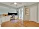 Home office with built-in shelving and hardwood floors at 3136 Heartleaf Pl, Winter Park, FL 32792