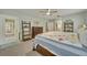 Spacious bedroom with a large bed, dresser, and plenty of natural light at 3136 Heartleaf Pl, Winter Park, FL 32792