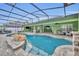Large freeform pool with a waterfall feature at 3136 Heartleaf Pl, Winter Park, FL 32792