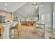 Open kitchen with breakfast bar and views to living room at 3136 Heartleaf Pl, Winter Park, FL 32792