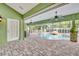 Inviting pool area with covered patio and outdoor kitchen at 3136 Heartleaf Pl, Winter Park, FL 32792