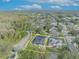 Aerial view of a house with solar panels and a pool, situated in a residential neighborhood at 3136 Heartleaf Pl, Winter Park, FL 32792