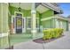 Front porch with rocking chair and seasonal decor at 3136 Heartleaf Pl, Winter Park, FL 32792