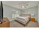 Bright bedroom featuring a comfortable bed and plenty of closet space at 3136 Heartleaf Pl, Winter Park, FL 32792