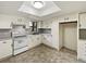Kitchen with white cabinets and modern appliances at 303 Carleton St, Lakeland, FL 33803