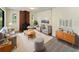 Living room featuring a fireplace and mid-century modern furniture at 303 Carleton St, Lakeland, FL 33803
