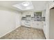 Bright kitchen with white cabinets and vinyl flooring at 303 Carleton St, Lakeland, FL 33803