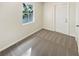 Simple bedroom with grey carpet and a window at 303 Carleton St, Lakeland, FL 33803