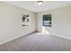 Spacious bedroom with two windows and neutral carpeting at 303 Carleton St, Lakeland, FL 33803