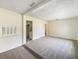 Spacious living room with carpeted floors and a fireplace at 303 Carleton St, Lakeland, FL 33803
