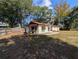 Spacious backyard with shed and patio area at 1301 Redwood Ct, Tavares, FL 32778