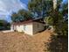 House exterior view, side view, with backyard at 1301 Redwood Ct, Tavares, FL 32778