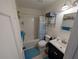Clean bathroom with tub shower combo and vanity at 1301 Redwood Ct, Tavares, FL 32778