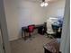 Home office with a large monitor and comfortable chair at 1301 Redwood Ct, Tavares, FL 32778