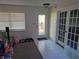 Home entryway with tiled floors, glass-paned front door, and French doors at 1301 Redwood Ct, Tavares, FL 32778