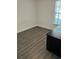 Bedroom with gray vinyl flooring and a dark brown desk at 4647 Cason Cove Dr # 2425, Orlando, FL 32811