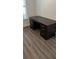 Dark brown desk with drawers in home office at 4647 Cason Cove Dr # 2425, Orlando, FL 32811