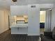 Kitchen with white cabinets and a breakfast bar at 4647 Cason Cove Dr # 2425, Orlando, FL 32811