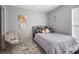 Cozy bedroom featuring a comfy bed and playful decor at 6844 Pomeroy Cir, Orlando, FL 32810