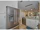 Modern kitchen with stainless steel appliances and white cabinetry at 912 Charo Pkwy # 223, Davenport, FL 33897