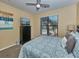 Bedroom with a king-size bed, TV, dresser and pool view at 912 Charo Pkwy # 223, Davenport, FL 33897