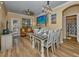 Living room showcases a brown leather sofa and coastal-themed artwork at 912 Charo Pkwy # 223, Davenport, FL 33897