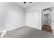 Spacious bedroom with double door closet and hardwood floors at 405 N Mcdonald Ave, Deland, FL 32724