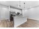 Modern kitchen with stainless steel appliances and granite countertops at 405 N Mcdonald Ave, Deland, FL 32724