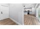 Bright entryway with view of kitchen and living area at 405 N Mcdonald Ave, Deland, FL 32724