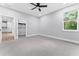 Large bedroom with walk-in closet and ceiling fan at 405 N Mcdonald Ave, Deland, FL 32724