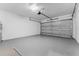 Garage with automatic opener and painted floor at 405 N Mcdonald Ave, Deland, FL 32724