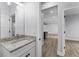Stylish bathroom with granite countertop and view into living area at 405 N Mcdonald Ave, Deland, FL 32724