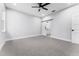 Bright bedroom featuring a barn door and grey carpet at 405 N Mcdonald Ave, Deland, FL 32724