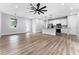 Spacious living area with hardwood floors and an open kitchen at 405 N Mcdonald Ave, Deland, FL 32724