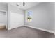 Spacious bedroom with double-door closet and window at 405 N Mcdonald Ave, Deland, FL 32724