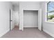 Well-lit bedroom with closet and hardwood floors at 405 N Mcdonald Ave, Deland, FL 32724