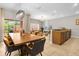 Open concept dining room with kitchen and living room views at 2955 Banana Palm Dr, Kissimmee, FL 34747