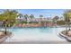 Relaxing pool with waterfall and ample lounge space at 2955 Banana Palm Dr, Kissimmee, FL 34747