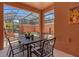 Covered patio with seating and a view of the pool at 2955 Banana Palm Dr, Kissimmee, FL 34747