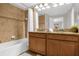 Bathroom with a shower, tub, and double vanity at 2955 Banana Palm Dr, Kissimmee, FL 34747