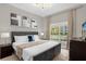 King-size bedroom with large window and ample natural light at 2955 Banana Palm Dr, Kissimmee, FL 34747